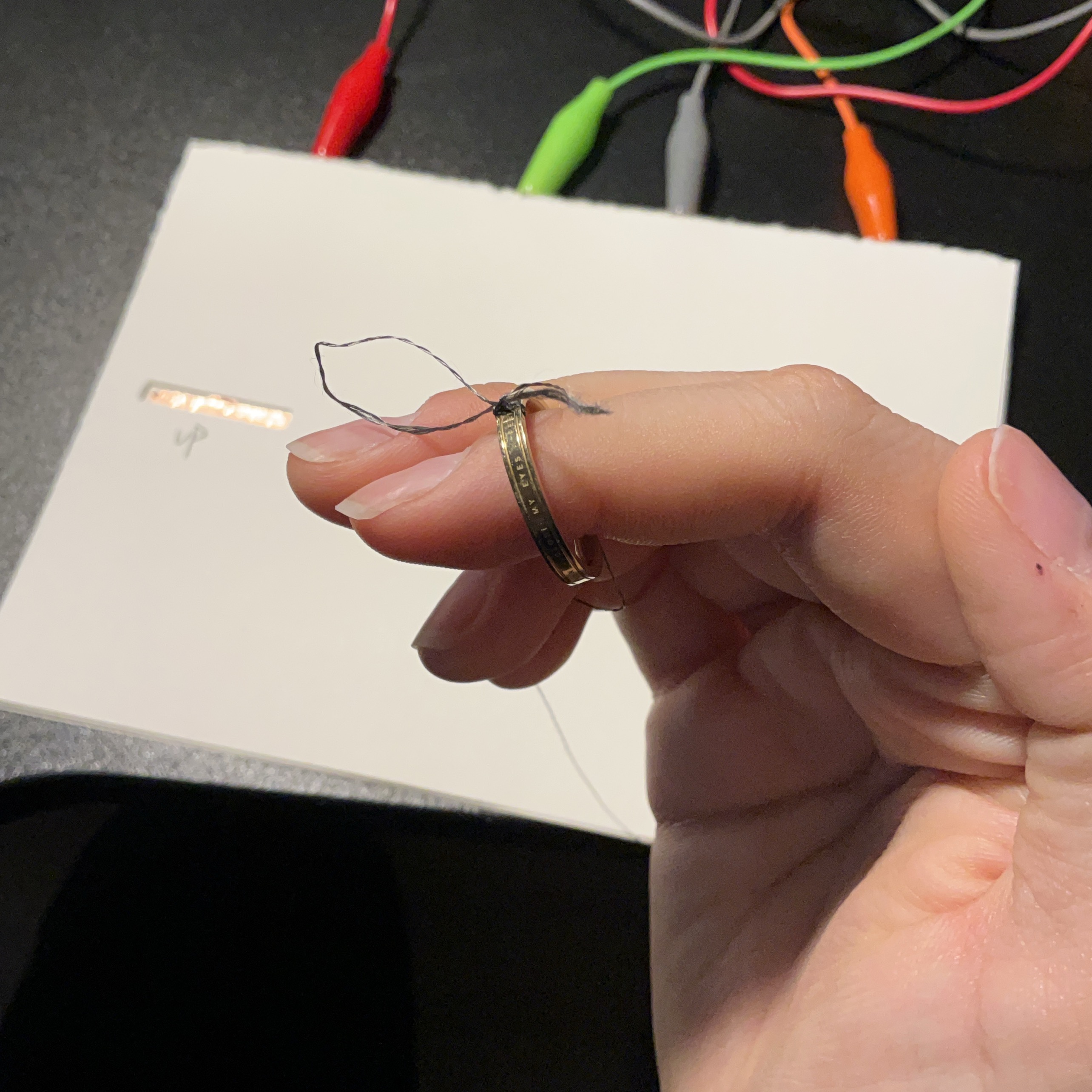 This is the conductive string I tied to the ring so I could touch the mechanism directly.